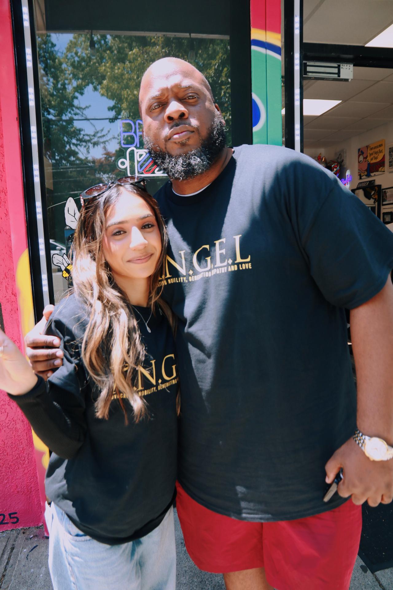 ANGEL team members outside the shop